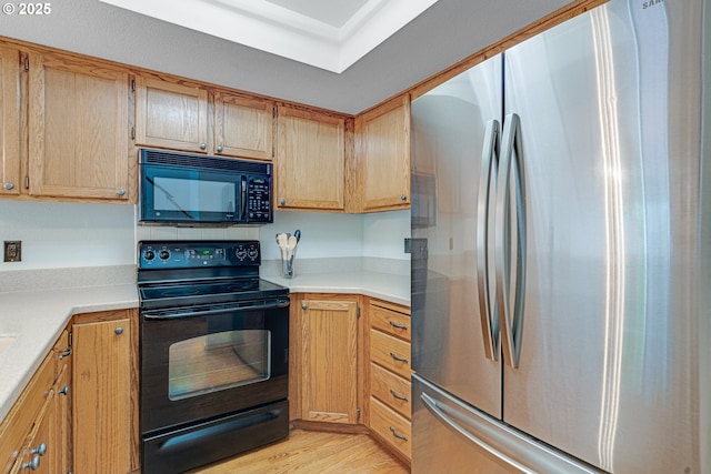 2038 Titan Ter, West Linn, OR 97068 - kitchen featuring black appliances, light countertops, and light wood-type flooring