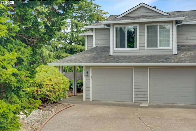 2038 Titan Ter, West Linn, OR 97068 - view of front facade featuring concrete driveway, an attached garage, and a shingled roof