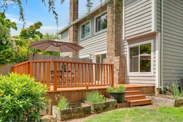 2038 Titan Ter, West Linn, OR 97068 - back of property with a vegetable garden, a deck, and a chimney