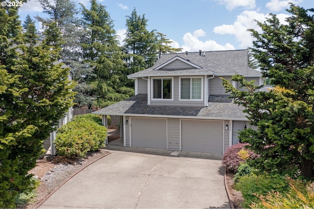 2038 Titan Ter, West Linn, OR 97068 - view of front of house with a shingled roof, concrete driveway, and an attached garage