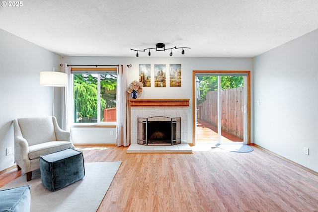 2038 Titan Ter, West Linn, OR 97068 - living area with wood finished floors and a tiled fireplace