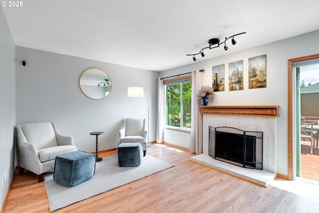 2038 Titan Ter, West Linn, OR 97068 - living area featuring wood finished floors and a tile fireplace