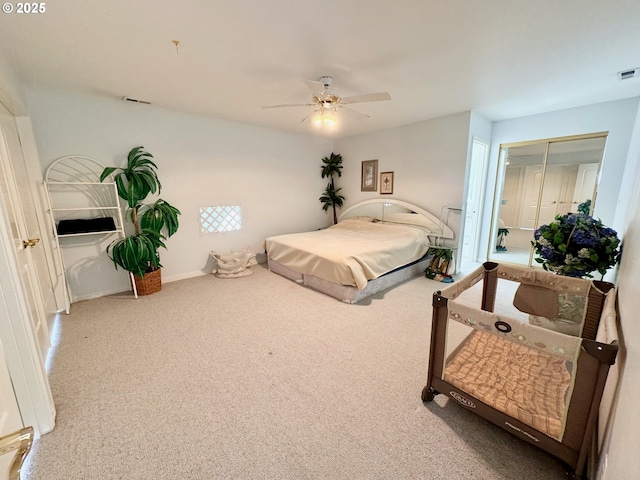 bedroom with ceiling fan and a closet