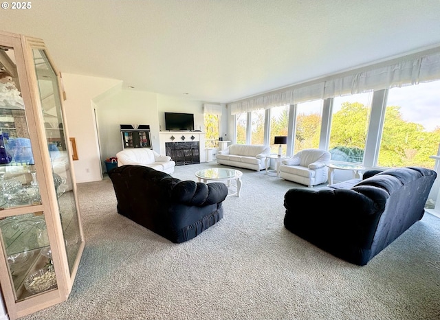 carpeted living room with a tiled fireplace