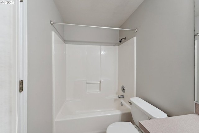 full bathroom featuring bathtub / shower combination, vanity, and toilet