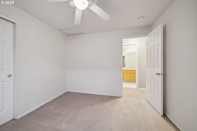 carpeted empty room featuring ceiling fan