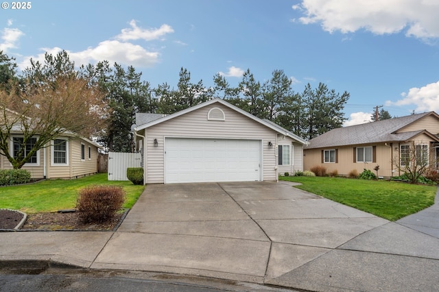 ranch-style home with a garage and a front lawn