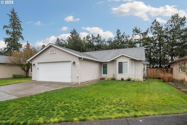 ranch-style home featuring a garage and a front yard