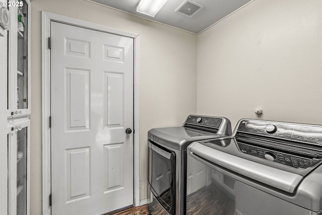 112 Stoneway Ln, Longview, WA 98632 - washroom with washing machine and dryer and dark wood-style flooring