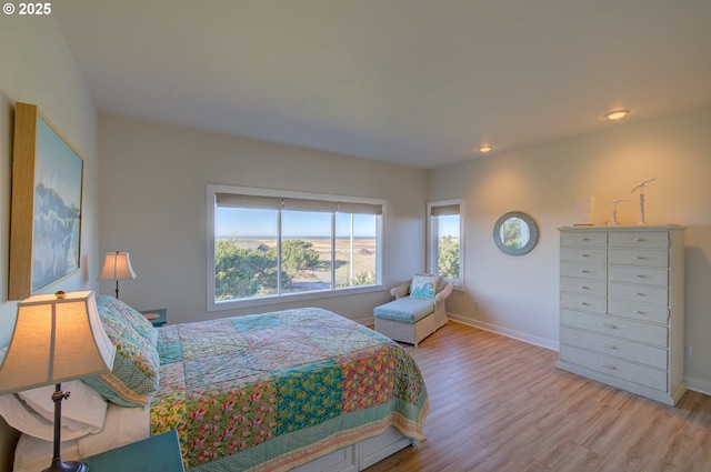 bedroom with light hardwood / wood-style floors