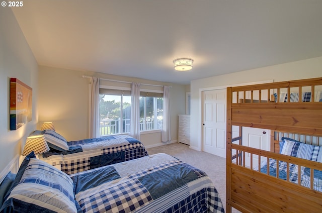 bedroom featuring light colored carpet