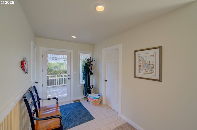 doorway featuring light tile patterned flooring