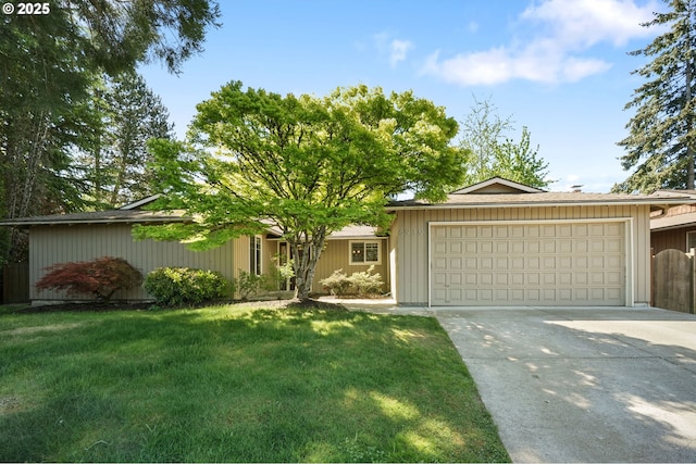 single story home featuring a garage and concrete driveway