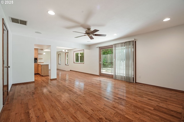 unfurnished living room featuring ceiling fan, light wood-style flooring, and recessed lighting