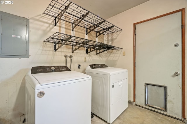 laundry area with electric panel and washer and clothes dryer