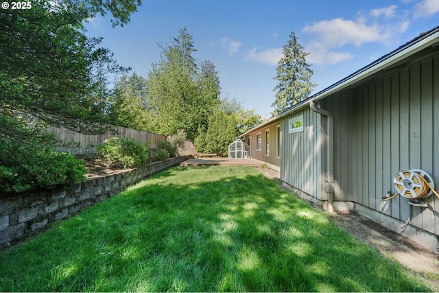 view of yard with a shed and an outbuilding