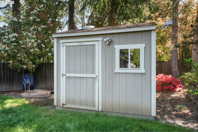 view of shed with fence