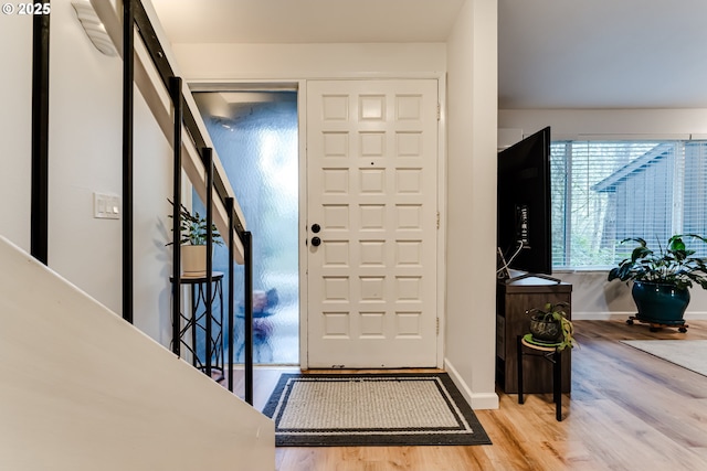 foyer entrance with light wood-type flooring