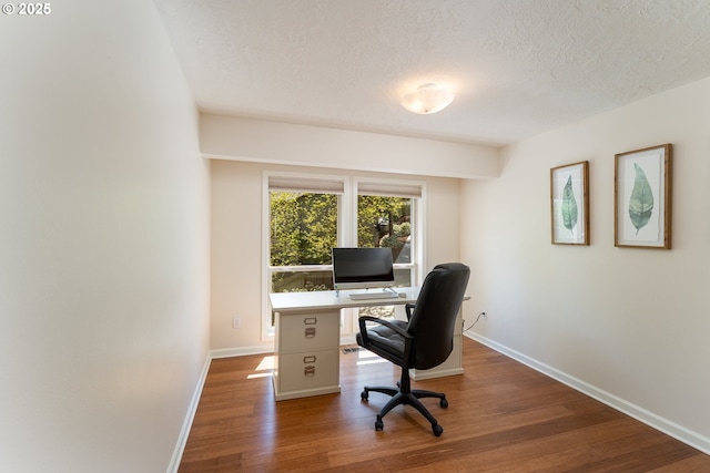 home office with baseboards, a textured ceiling, and wood finished floors