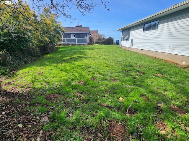 view of yard featuring fence