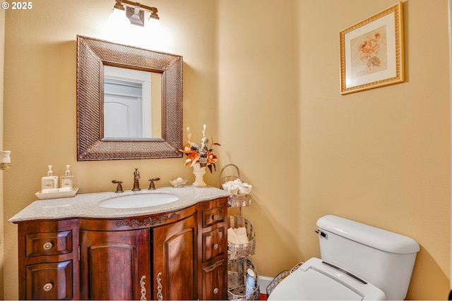 half bath with toilet and vanity