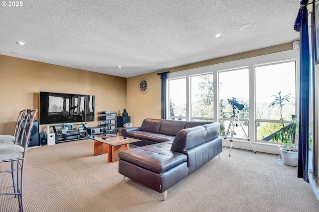 carpeted living room featuring recessed lighting and a textured ceiling