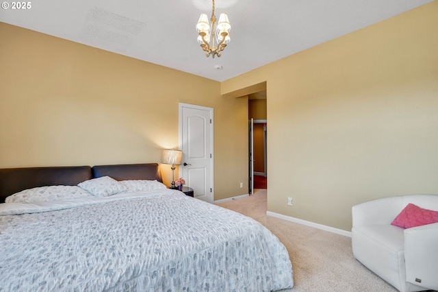 bedroom featuring light carpet, a notable chandelier, and baseboards