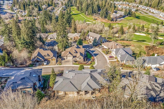 birds eye view of property featuring view of golf course and a residential view