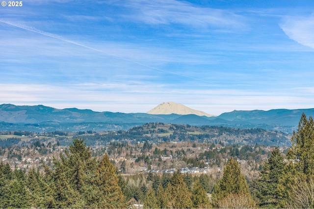 mountain view featuring a view of trees