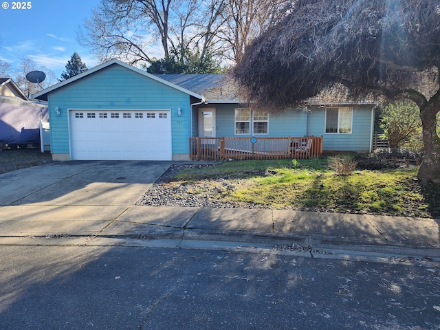 single story home featuring an attached garage, covered porch, and driveway