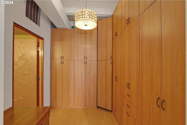 corridor with light wood finished floors