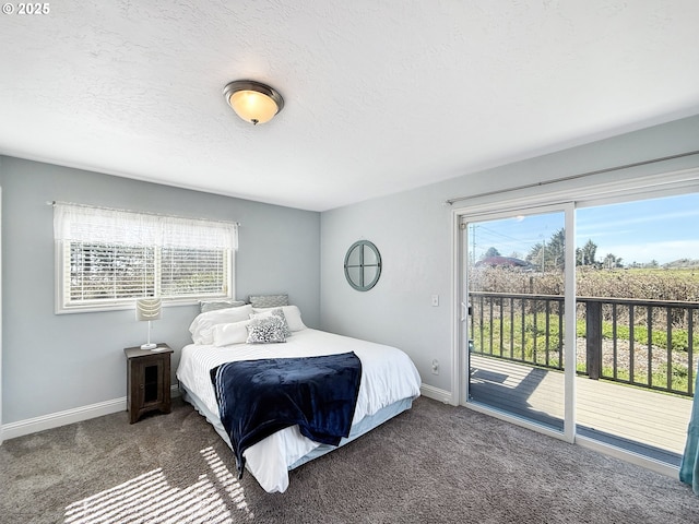 bedroom featuring carpet floors, multiple windows, and access to outside