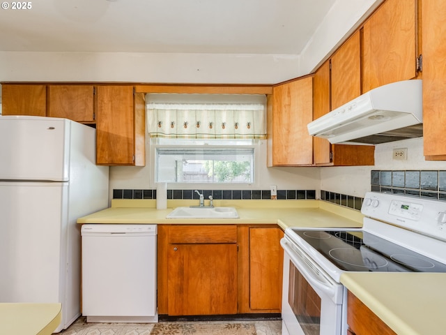 660 Barton Ave, Gladstone, OR 97027 - kitchen with white appliances, under cabinet range hood, light countertops, and brown cabinetry