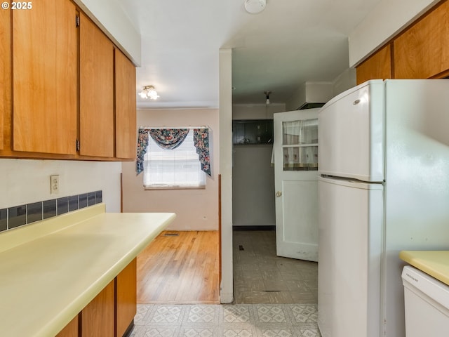 660 Barton Ave, Gladstone, OR 97027 - kitchen with white appliances, brown cabinetry, light countertops, and light floors