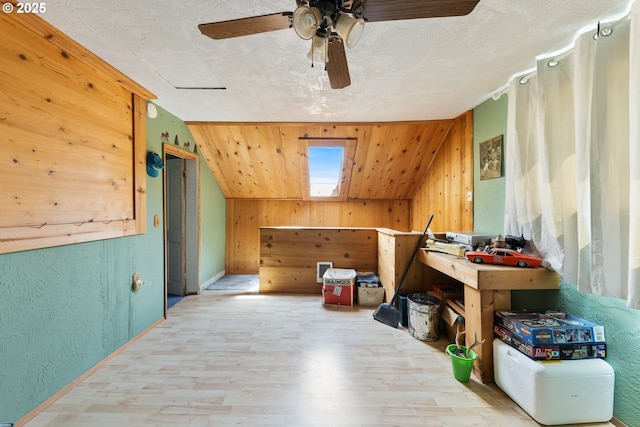 540 Kesling St, Harrisburg, OR 97446 - bonus room featuring wood finished floors, vaulted ceiling, baseboards, wood walls, and ceiling fan