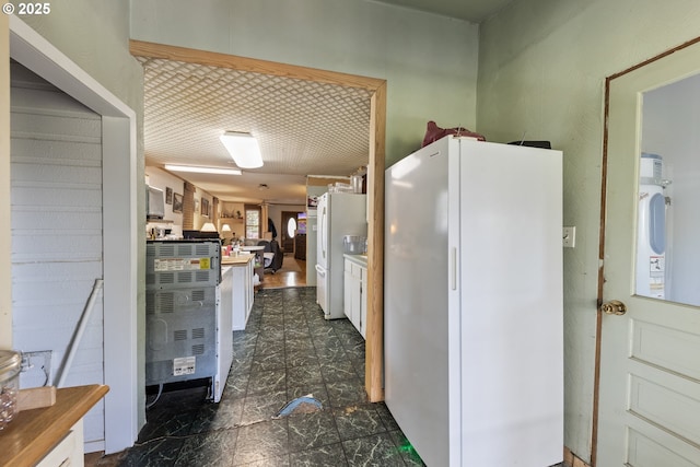 540 Kesling St, Harrisburg, OR 97446 - kitchen featuring freestanding refrigerator and white cabinets