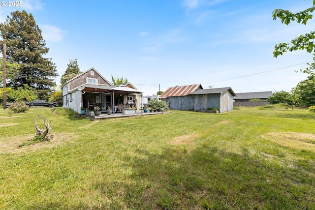 540 Kesling St, Harrisburg, OR 97446 - view of green lawn with an outdoor structure and a shed
