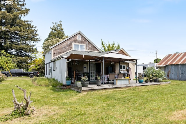 540 Kesling St, Harrisburg, OR 97446 - back of property with a lawn and a deck