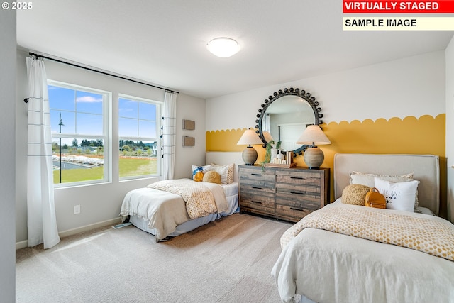 bedroom with carpet floors and baseboards