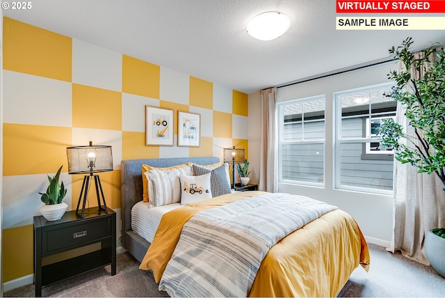 carpeted bedroom featuring a textured ceiling and baseboards