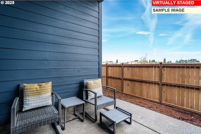 view of patio / terrace featuring fence