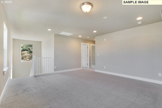 empty room featuring light carpet