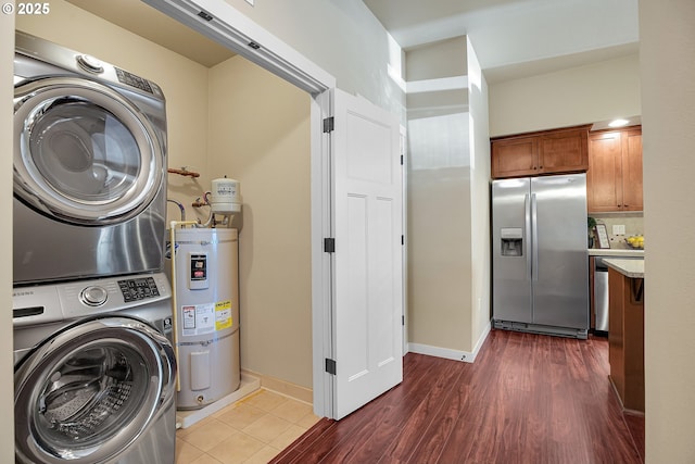 13885 SW Meridian St Unit 135, Beaverton, OR 97005 - laundry room with stacked washer and clothes dryer, strapped water heater, and dark wood-style floors