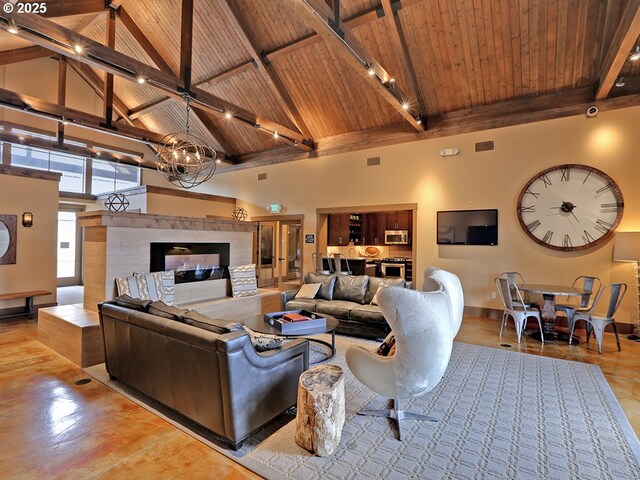 13885 SW Meridian St Unit 135, Beaverton, OR 97005 - living area featuring a wooden ceiling with exposed beams, high vaulted ceiling, a chandelier, and a tiled fireplace