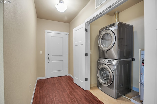 13885 SW Meridian St Unit 135, Beaverton, OR 97005 - washroom with estacked washer and dryer and wood finished floors