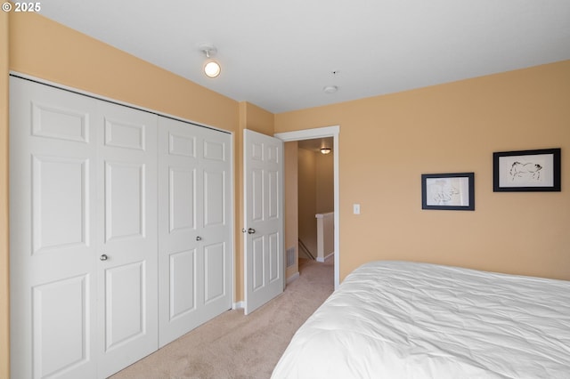 bedroom featuring a closet and carpet floors