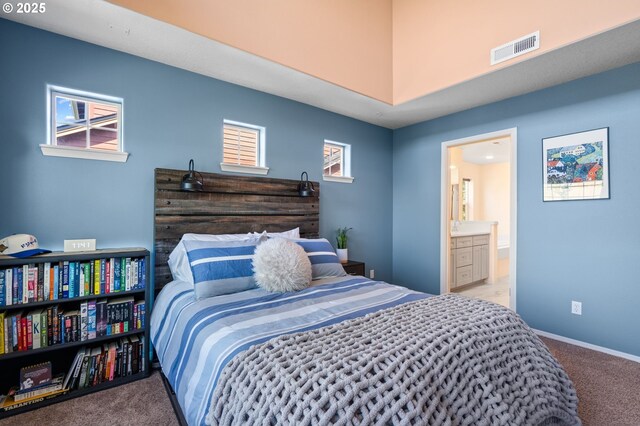 842 NE Rothbury Ave, Hillsboro, OR 97124 - carpeted bedroom featuring baseboards, visible vents, and connected bathroom