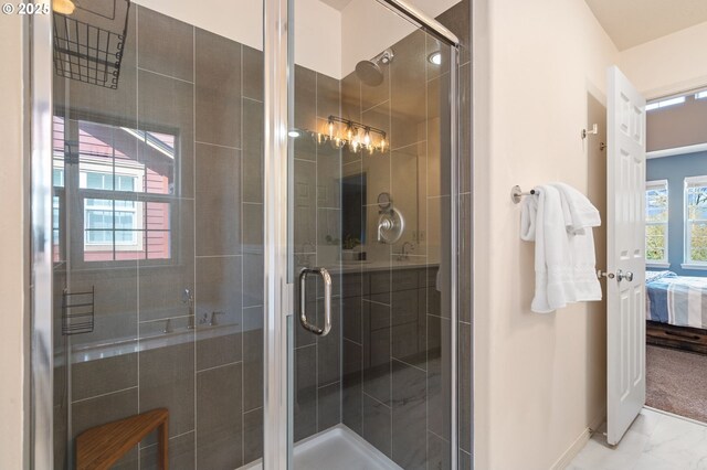 842 NE Rothbury Ave, Hillsboro, OR 97124 - bathroom with baseboards, ensuite bath, marble finish floor, and a shower stall