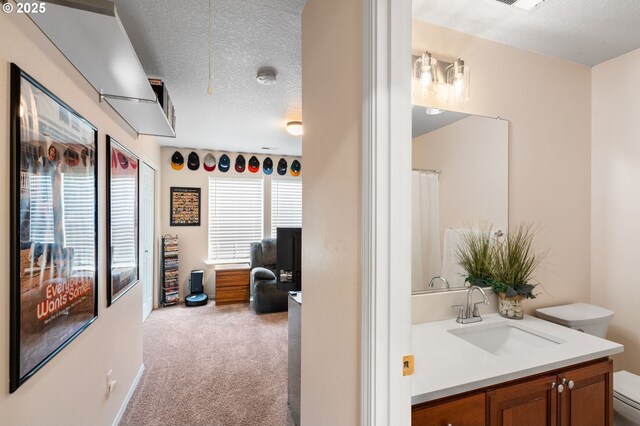 842 NE Rothbury Ave, Hillsboro, OR 97124 - bathroom with toilet, vanity, a textured ceiling, and visible vents
