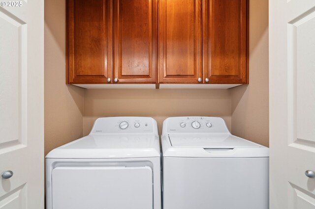 842 NE Rothbury Ave, Hillsboro, OR 97124 - laundry room featuring washing machine and dryer and cabinet space